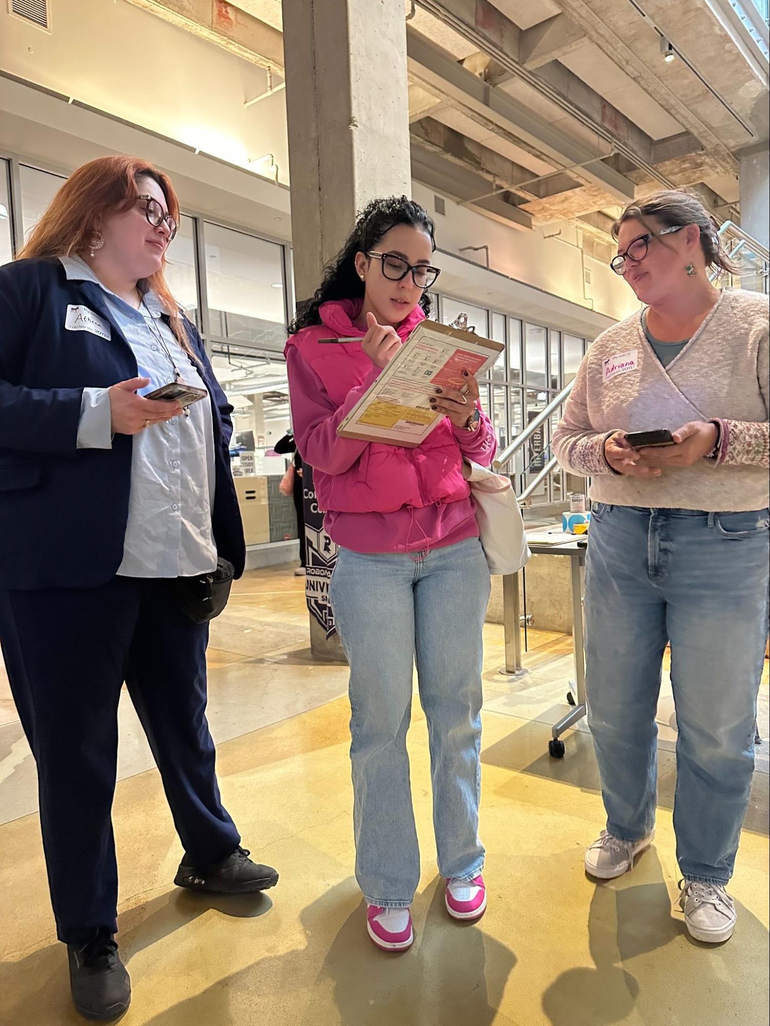 Powered by People volunteer registering a voter.