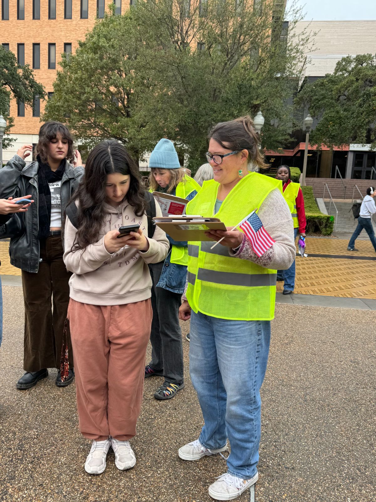 Powered by People volunteer registering a voter.