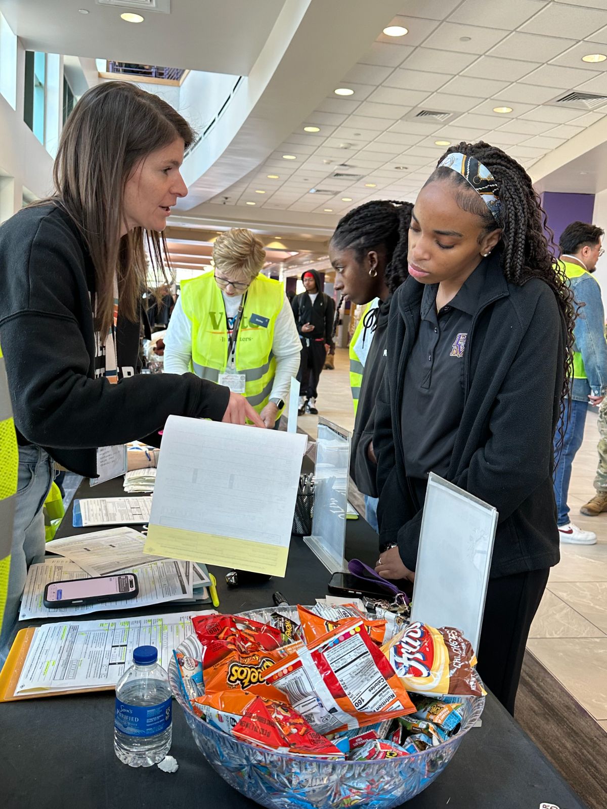 Aimee registering a student voter.